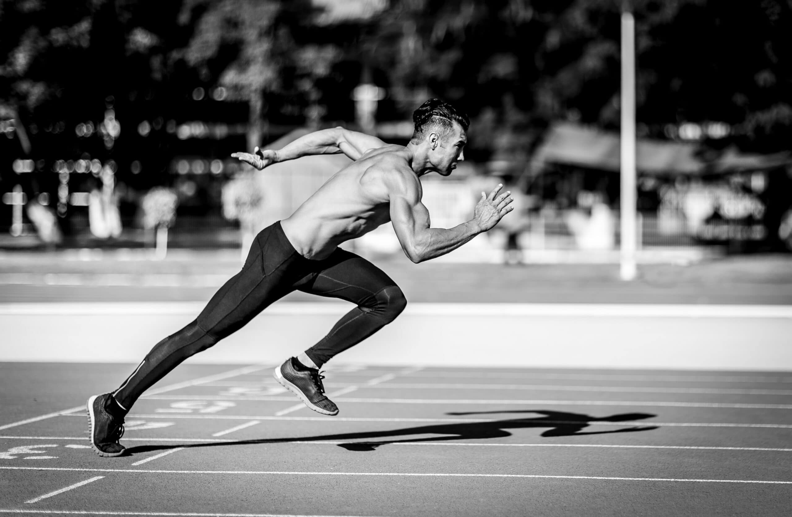 muscular-man-running-on-track